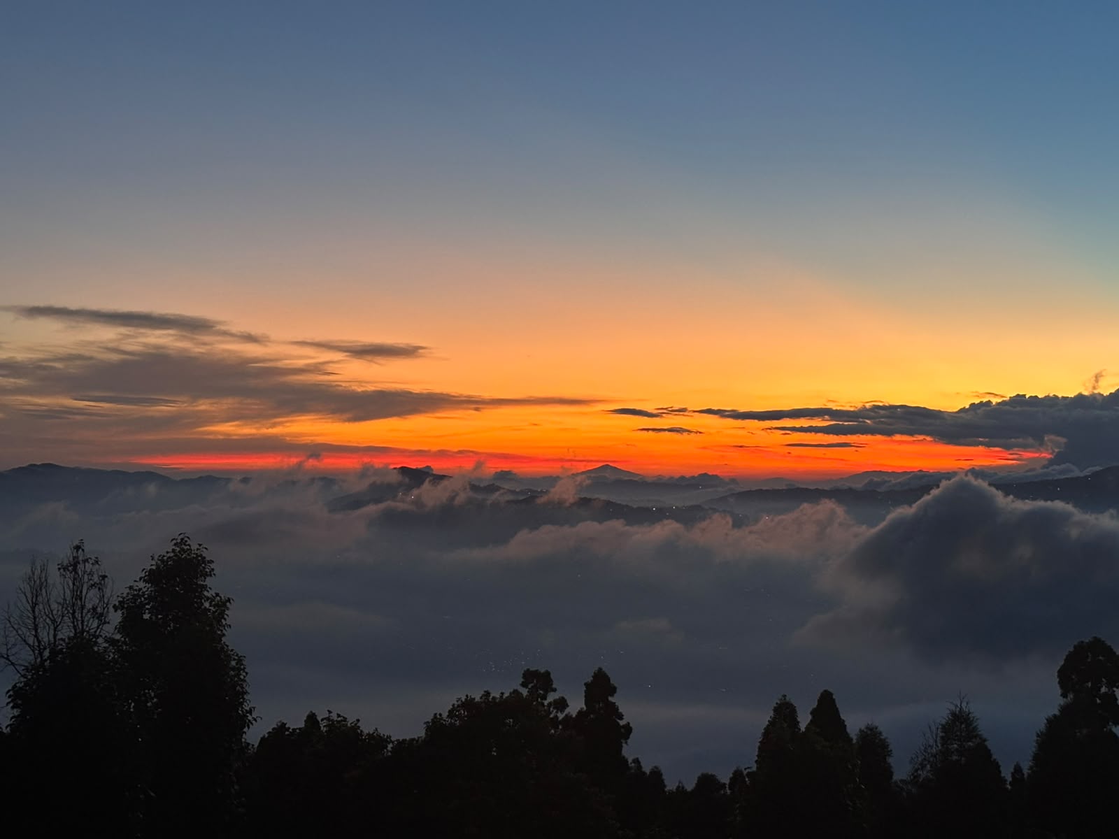 Fiery Twilight Above the Clouds